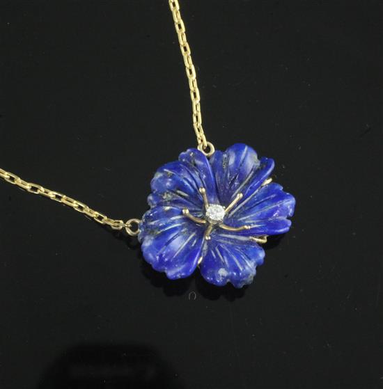 A 9ct gold, lapis lazuli and diamond set flower pendant, on a 9ct gold chain, pendant 24mm.